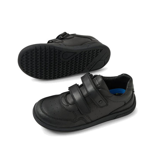 The Bobux Kid+ Scoot Black School Leather Sneaker Shoe features Velcro straps and a durable, textured sole—one shoe stands upright showing the top and side, while the other lies on its side, highlighting everyday school-ready comfort.