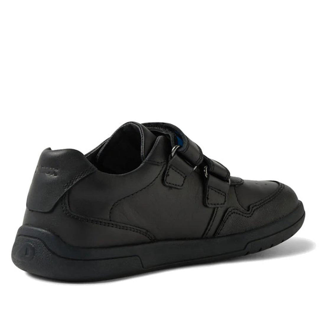 The Bobux Kid+ Scoot Black School Leather Sneaker Shoe features two Velcro straps, a padded collar, and a black rubber sole. Shown from a rear-side angle on a white background, it’s perfect for kids needing durable school sneakers., 48409, 9420074842510, 