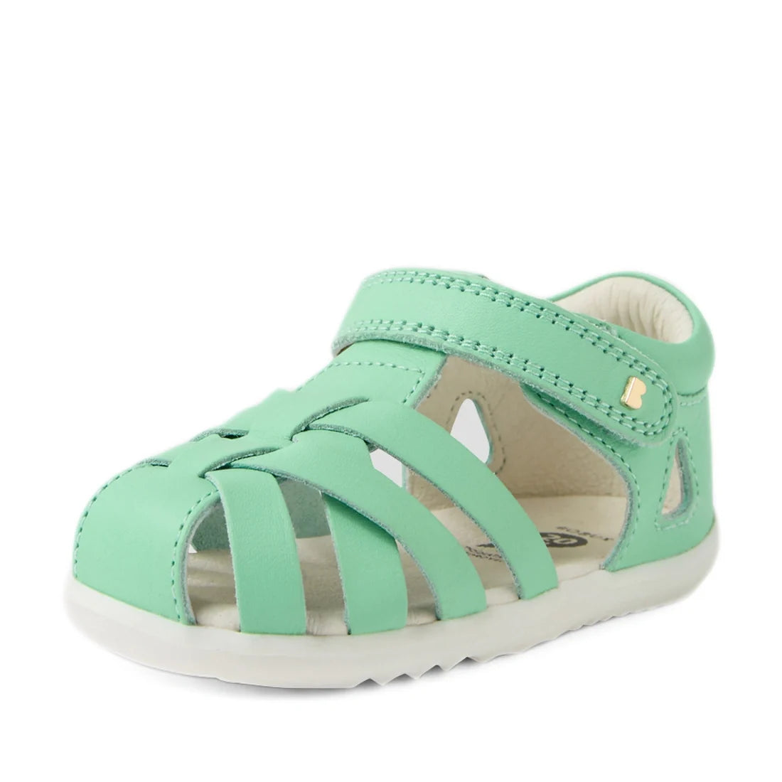 A stylish Bobux Step Up SU Tropicana II Mint Jelly Green Closed Toe Sandal for toddlers, featuring a mint green leather finish, woven straps, gold-tone stud detail on the side, a closed toe design, velcro strap fastening, and a white sole., 9420074809803,
