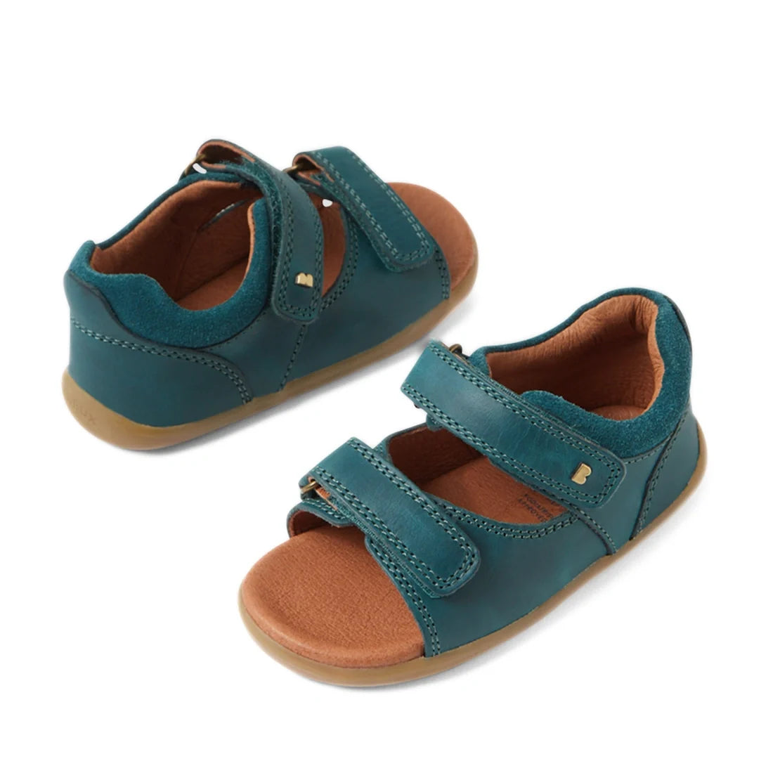 A pair of Mediterranean Green boys’ leather sandals, the Bobux SU Step Up Driftwood First Walker Open Toe Sandal, featuring two velcro straps and brown soles—perfect as first walking shoes—displayed on a white background.