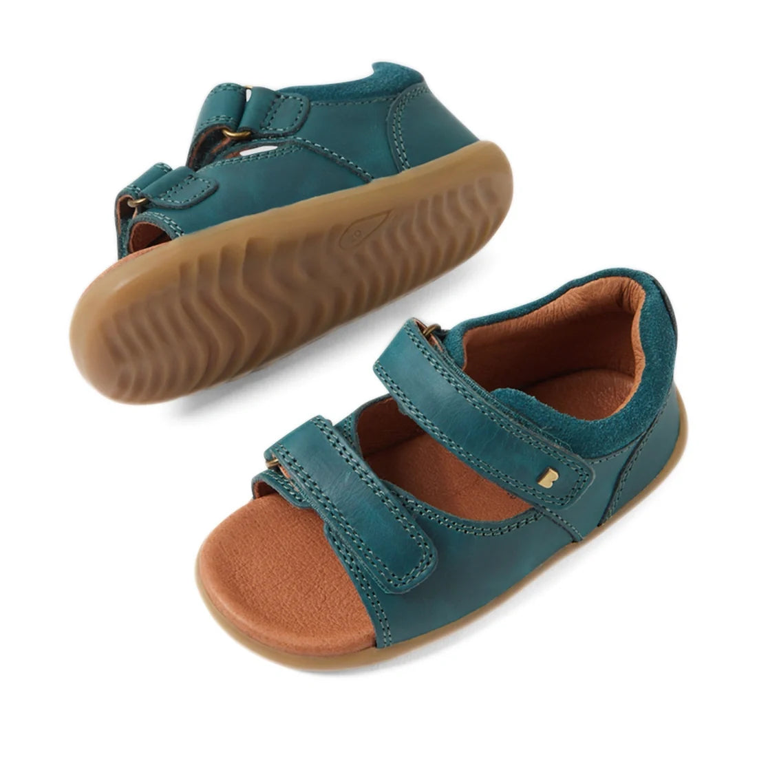 A pair of Bobux SU Step Up Driftwood First Walker Open Toe Sandal Mediterranean Green children’s sandals, featuring brown rubber soles, open toes, and two adjustable Velcro straps—perfect as first walking shoes—displayed on a white background., 9420074807