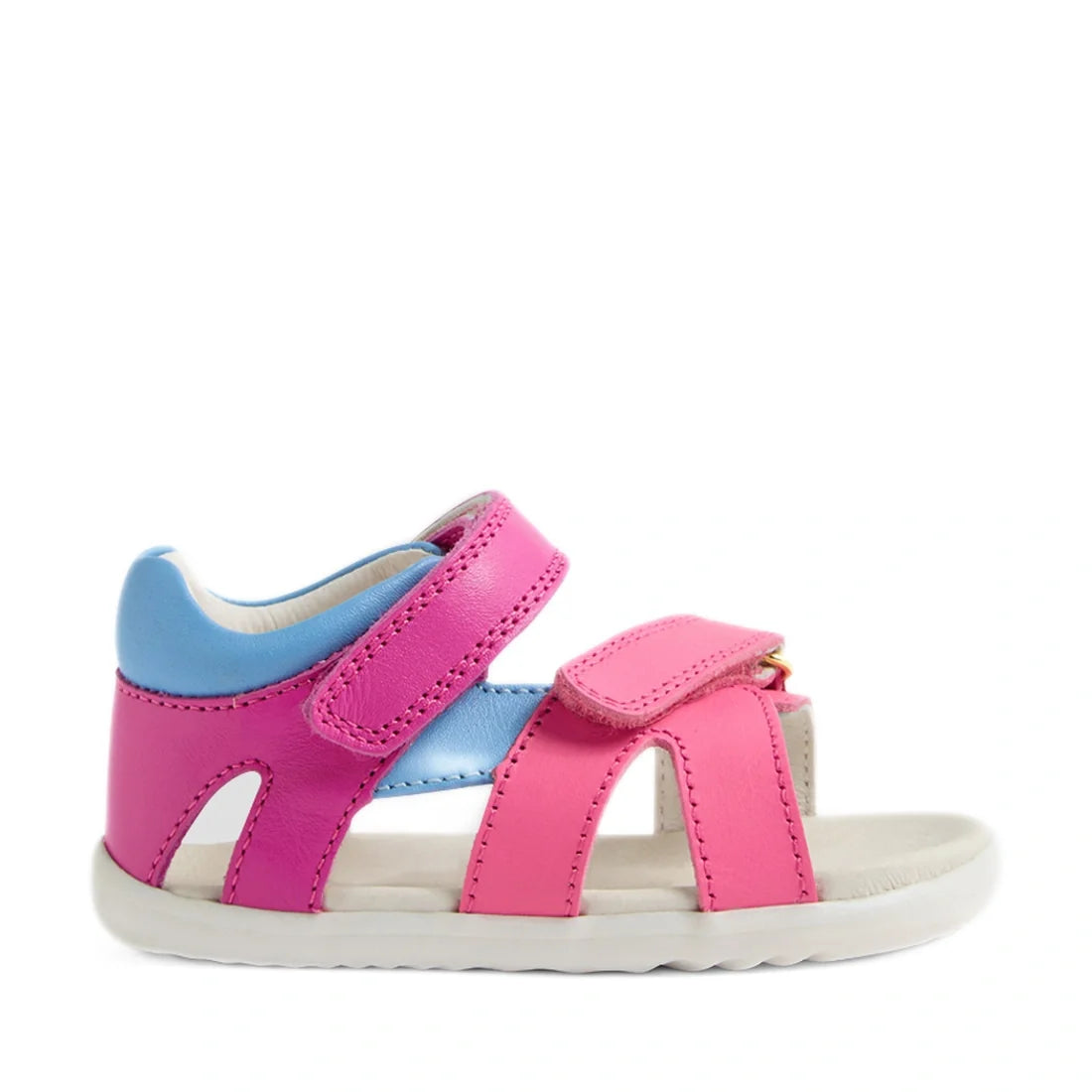 A vibrant children’s sandal, the Bobux SU Step Up Dune First Walker Open Toe Sandal in Rose Bright Pink, features bright pink adjustable straps, easy Velcro fastenings, and a comfortable white sole—thoughtfully designed for both style and comfort., 942007