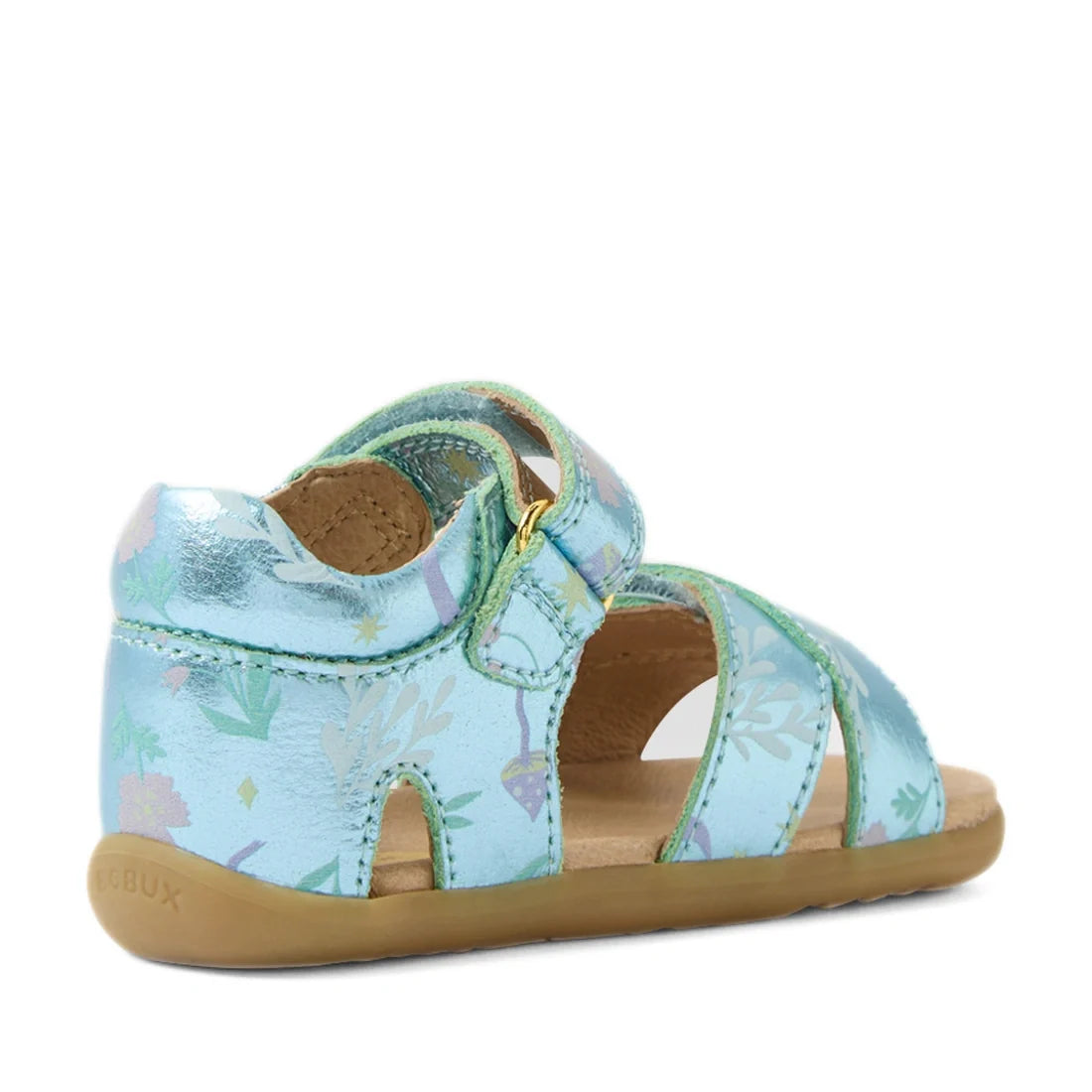 Bobux Step Up Flora First Walker Jelly Mint Metallic Blue sandal for toddlers, featuring shiny metallic blue leather with pastel floral patterns, an ankle strap with hook-and-loop closure, open sides, and a soft brown sole. The sandal is angled to show th