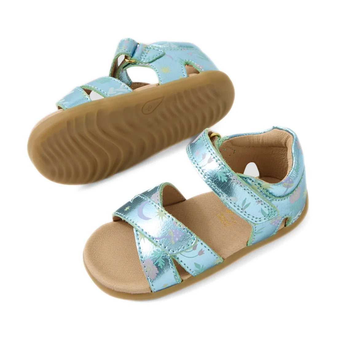 Bobux Step Up Flora First Walker Jelly Mint Metallic Blue sandal for children features open-toe metallic blue straps with moon and star embellishments, an adjustable Velcro closure, soft tan cushioned insole, and a light brown rubber sole. One leather san