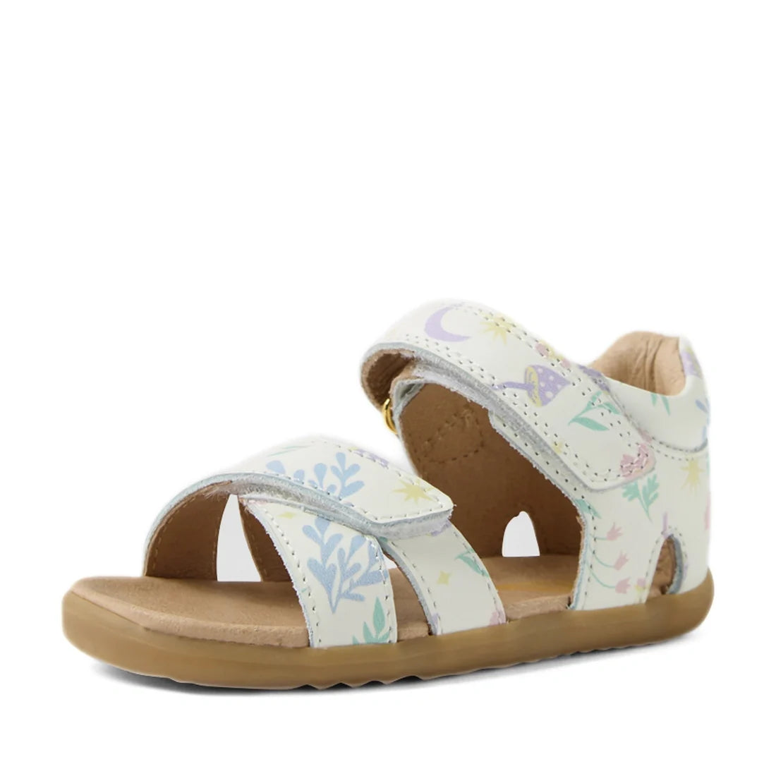 The Bobux Step Up Flora First Walker Sandal in White Floral features soft white leather straps decorated with a delicate floral and star print, an open toe design, and a tan rubber sole—making it the perfect first walking leather sandal for your little on