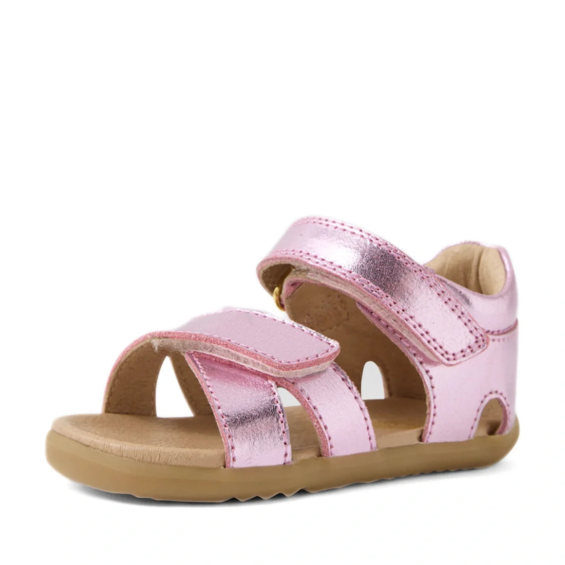 The Bobux Step Up Flora First Walker Sandal in Pink Lemonade Metallic is a shiny metallic pink leather sandal for toddlers, featuring two velcro straps, an open toe design, and a tan rubber sole—perfect as stylish first walker sandals. Displayed on a whit