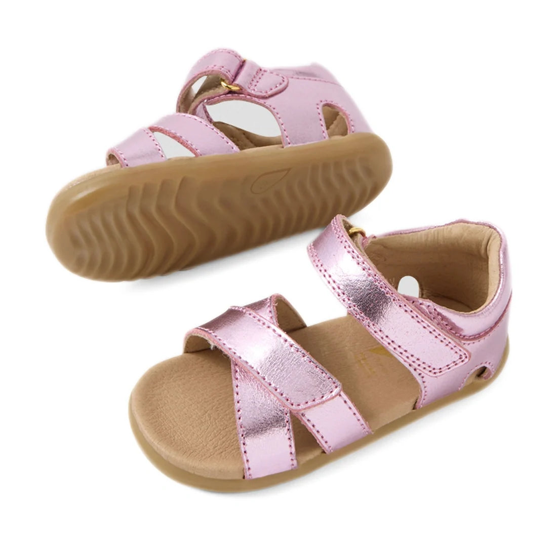 Two pairs of Bobux Step Up Flora First Walker Sandal in Pink Lemonade Metallic for toddlers, with tan soles, velcro straps, and open toes, displayed on a white background., 9420074848949, 9420074848956, 9420074848963