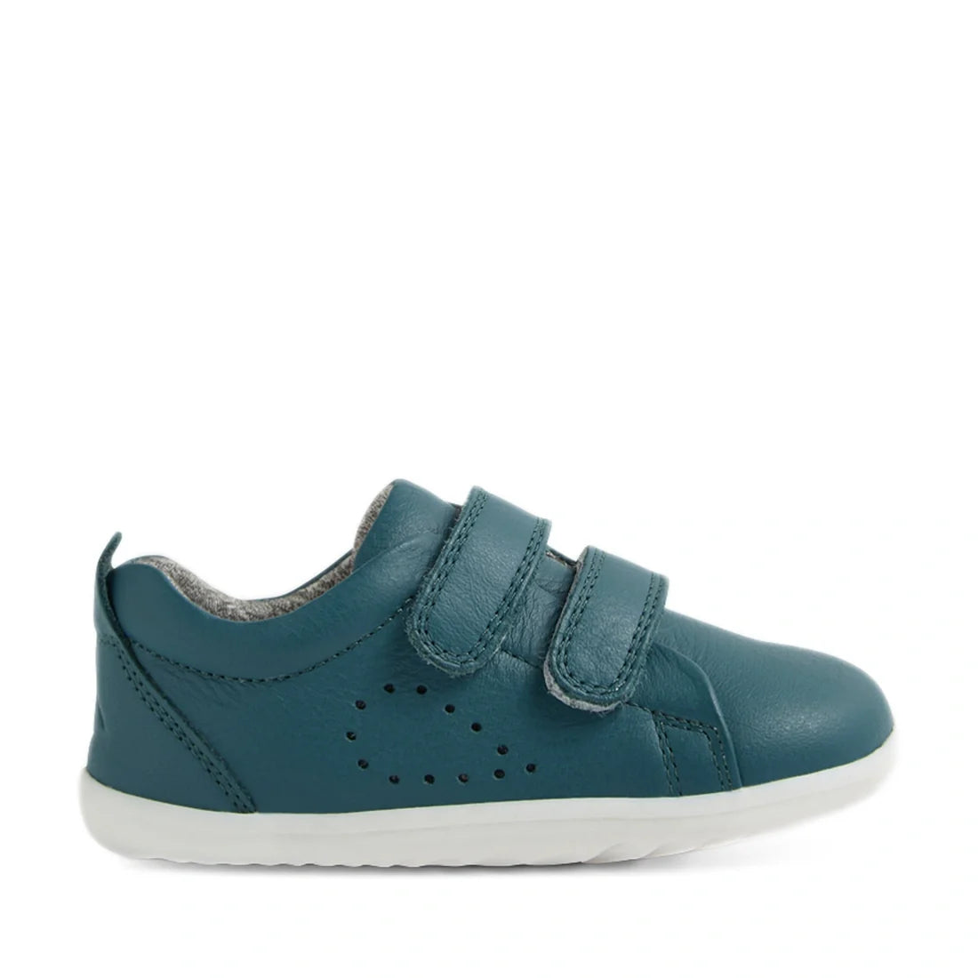 A Mediterranean Green Bobux Step Up Grass Court Trainer for children with two velcro straps, perforated side details, a white sole, and a soft gray inner lining, displayed in profile facing right. These high-quality leather sneakers are perfect as first w