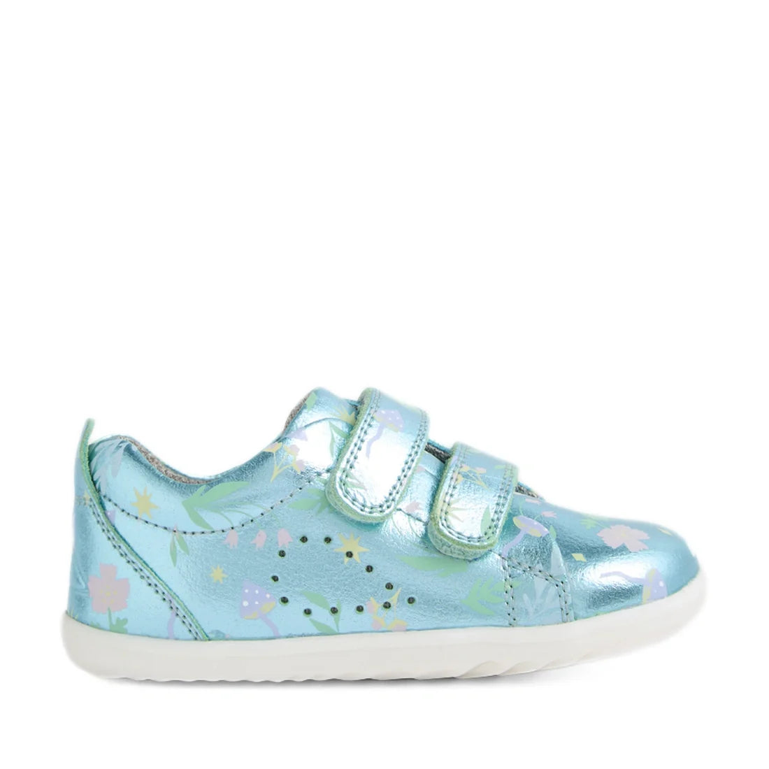 The Bobux Step Up Grass Court Trainer Jelly Mint Metallic Blue is a shiny light blue toddler shoe featuring two Velcro straps, a white sole, and a pastel floral and leaf pattern—making it perfect as a first walker shoe. The sneaker is shown in a side view
