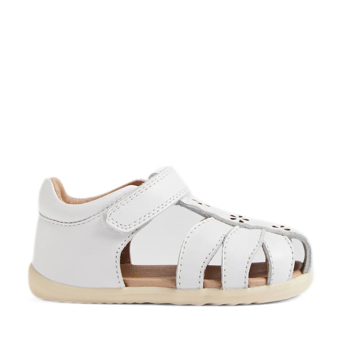 The Bobux Step Up Grass Holly First Walker Closed Toe Sandal in white—featuring a closed heel, open toe, cutout sides, and a Velcro strap—is displayed in a side view against a plain white background., 9420074849441, 9420074849458, 9420074849465