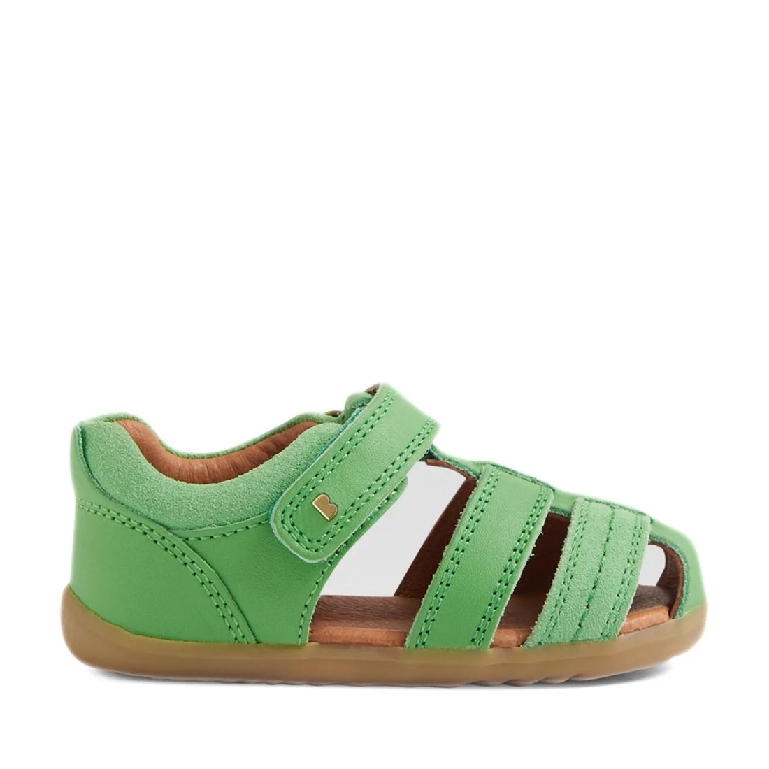 A single Bobux Step Up Sandal Roam Closed Toe Sandals in Retro Green for toddlers features a closed heel, open toe, three front straps, a Velcro strap closure, soft brown inner lining, and a light brown rubber sole—perfect first walkers shoes crafted for 