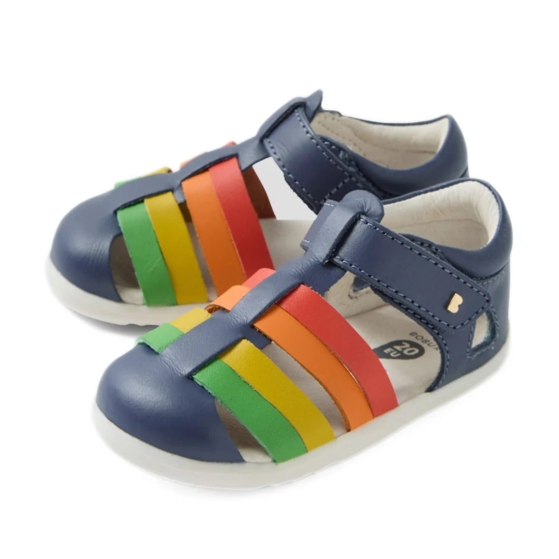 A pair of Bobux Step Up SU Toddlers Tidal Vintage Indigo Blue Closed Toe Sandals for toddlers, featuring multicolored straps in green, yellow, orange, and red set against a white background. Crafted from water-friendly leather, these sandals are perfect f
