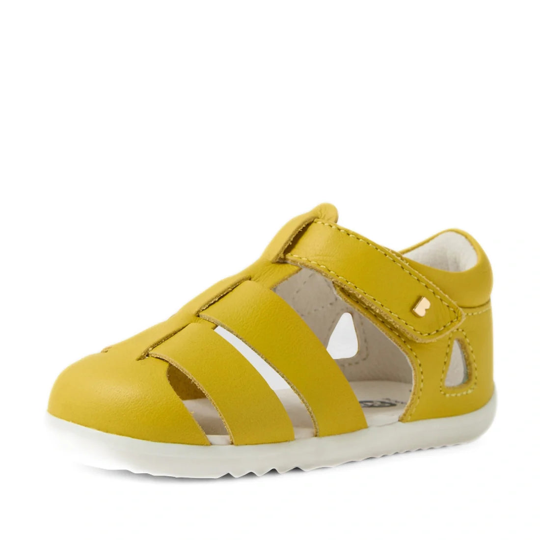 A Bobux Step Up SU Toddlers Tidal Mango Mint Yellow Closed Toe Sandal, featuring water-friendly leather in vibrant yellow with cut-out sides, a Velcro strap, and a white rubber sole—ideal as a first walker shoe—is displayed at an angle on a plain white ba