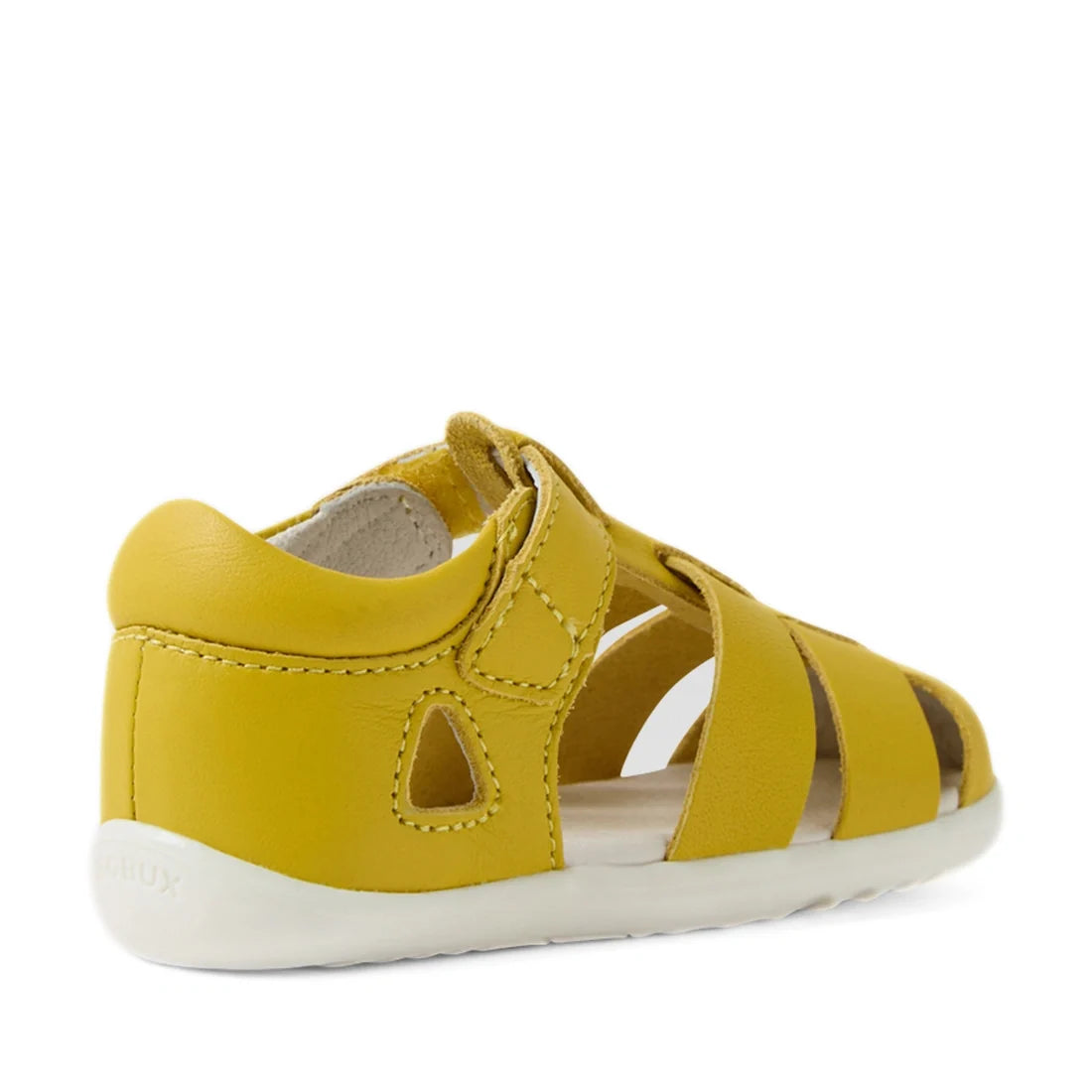 The Bobux Step Up SU Toddlers Tidal Mango Mint Yellow Closed Toe Sandal is crafted from water-friendly yellow leather and features a closed heel, open toe, white sole, and an easy Velcro strap. Viewed from the back right side, it’s an ideal first walker s