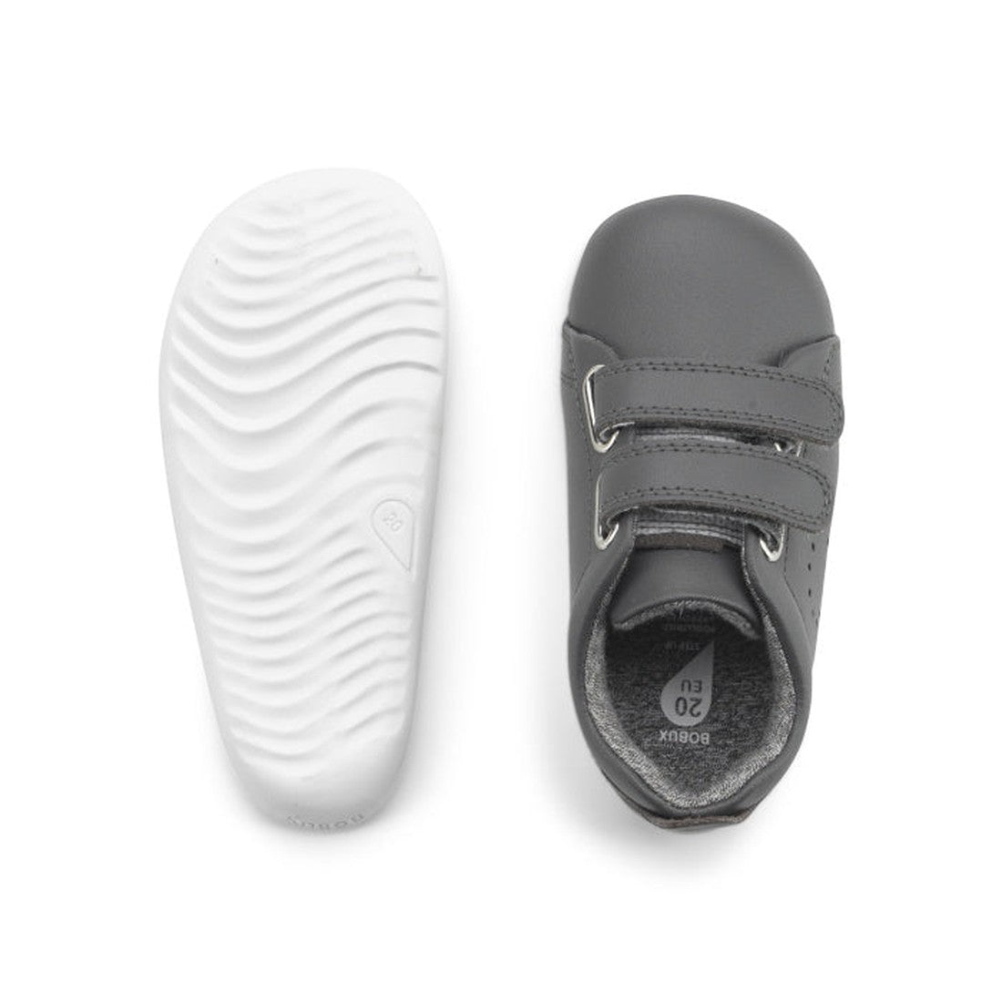 The Bobux Step Up First Shoes Grass Court Trainer 728913 in Smoke Grey are toddler shoes with Velcro straps; one shoe shows the top and the other reveals a white textured sole—ideal for little first-walkers., 9420057331574, 9420075789890, 9420075792630, 9