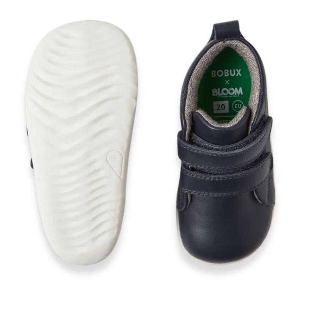 A pair of Bobux Step Up Grass Court Hi Boot Navy toddler sneakers with white textured soles, one shoe shown from the bottom and the other from the top; inside label reads “BOBUX x BLOOM, 20, EU.”., 9420075771741, 9420075774490, 9420075778368