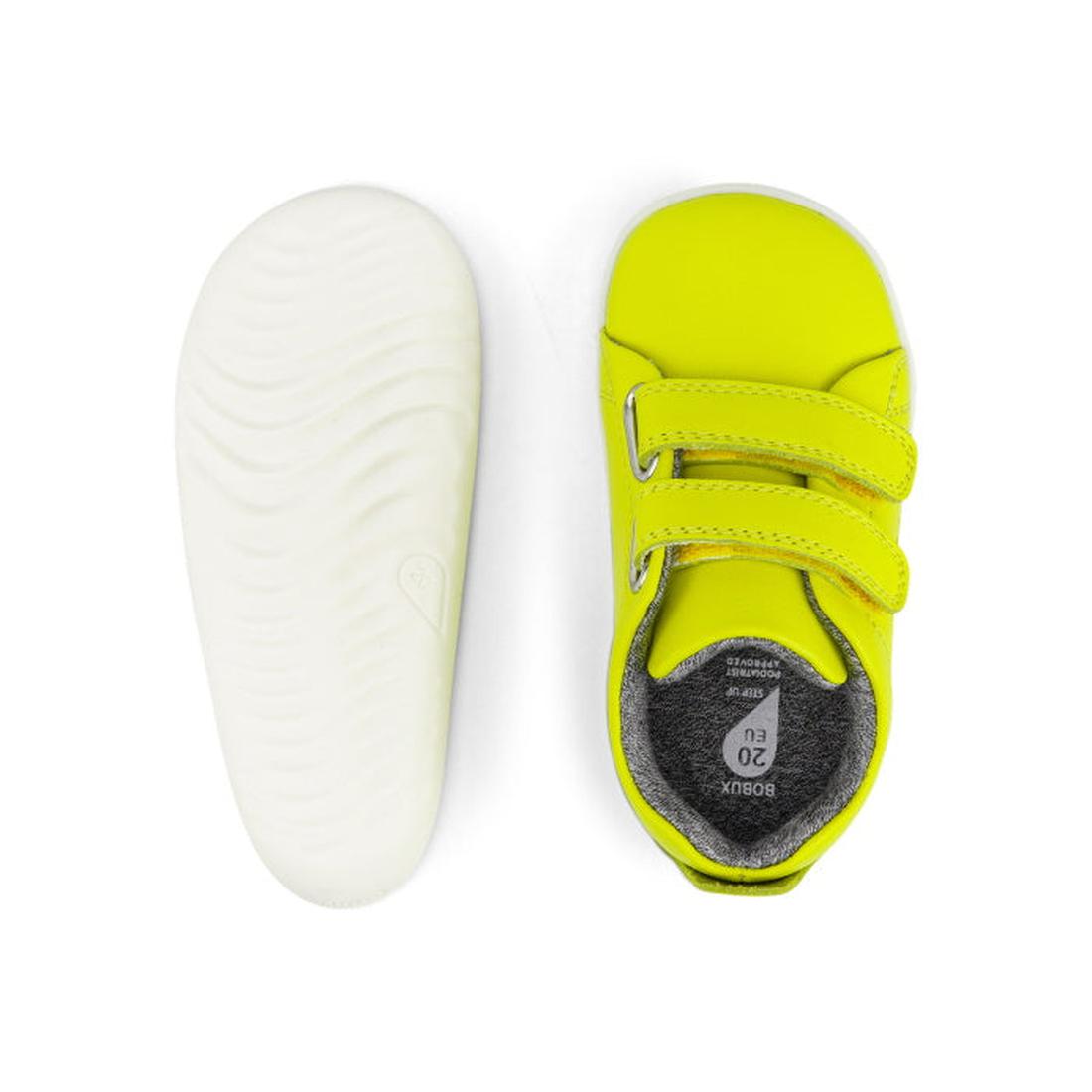 The Bobux Step Up - Grass Court Toddlers Sneaker 728941 Neon Yellow features bright yellow leather, a grey interior, two top adjustable straps, white wavy-textured soles, and is shown from both top and sole views., 9420068532564, 9420068532571, 9420068532