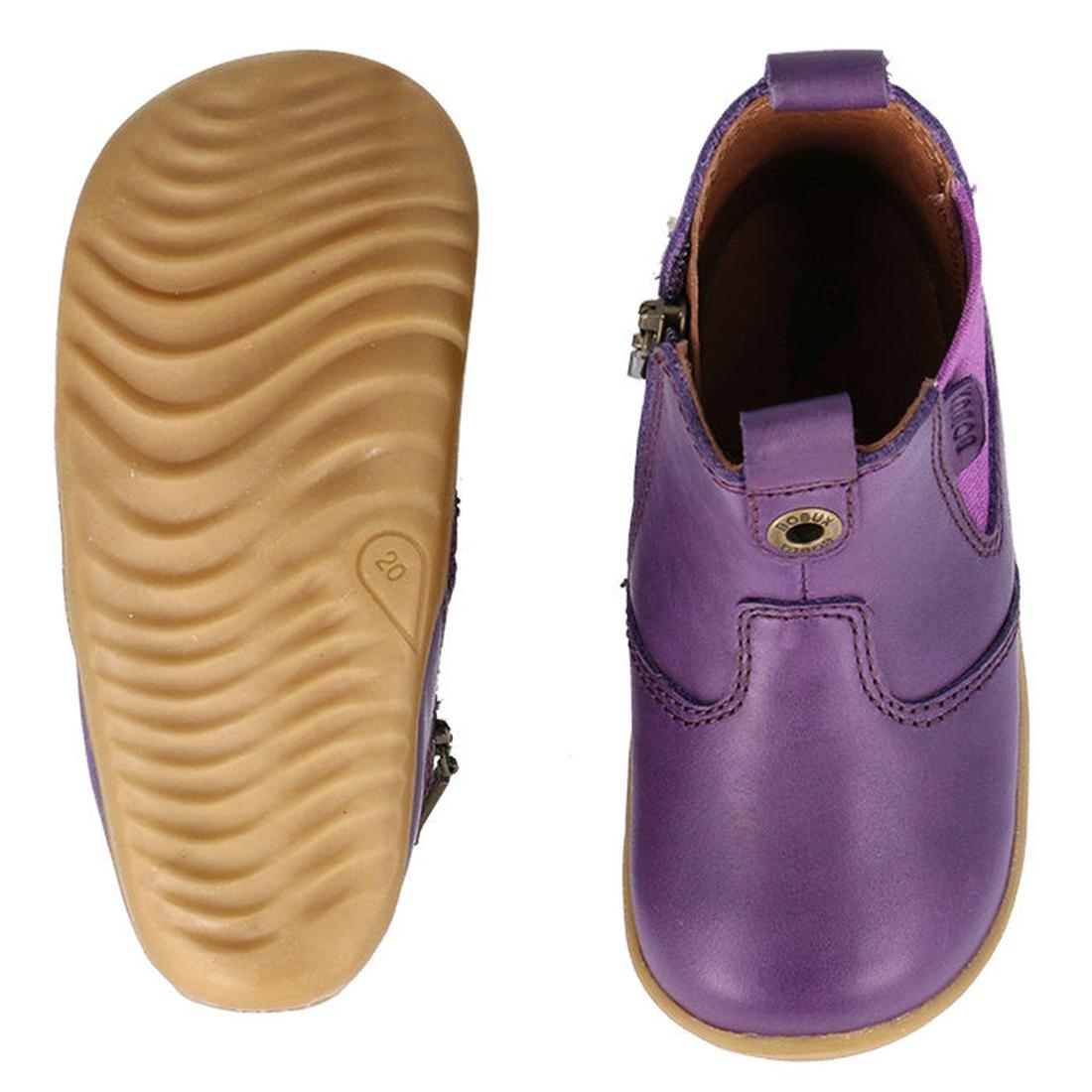The Bobux Step Up Jodphur Boot Indigo Purple is a children’s leather boot with tan rubber soles. Shown from top and bottom, highlights include a textured sole, side zipper, and decorative stitching—ideal for first walkers., 9420075788879, 9420075789456, 9