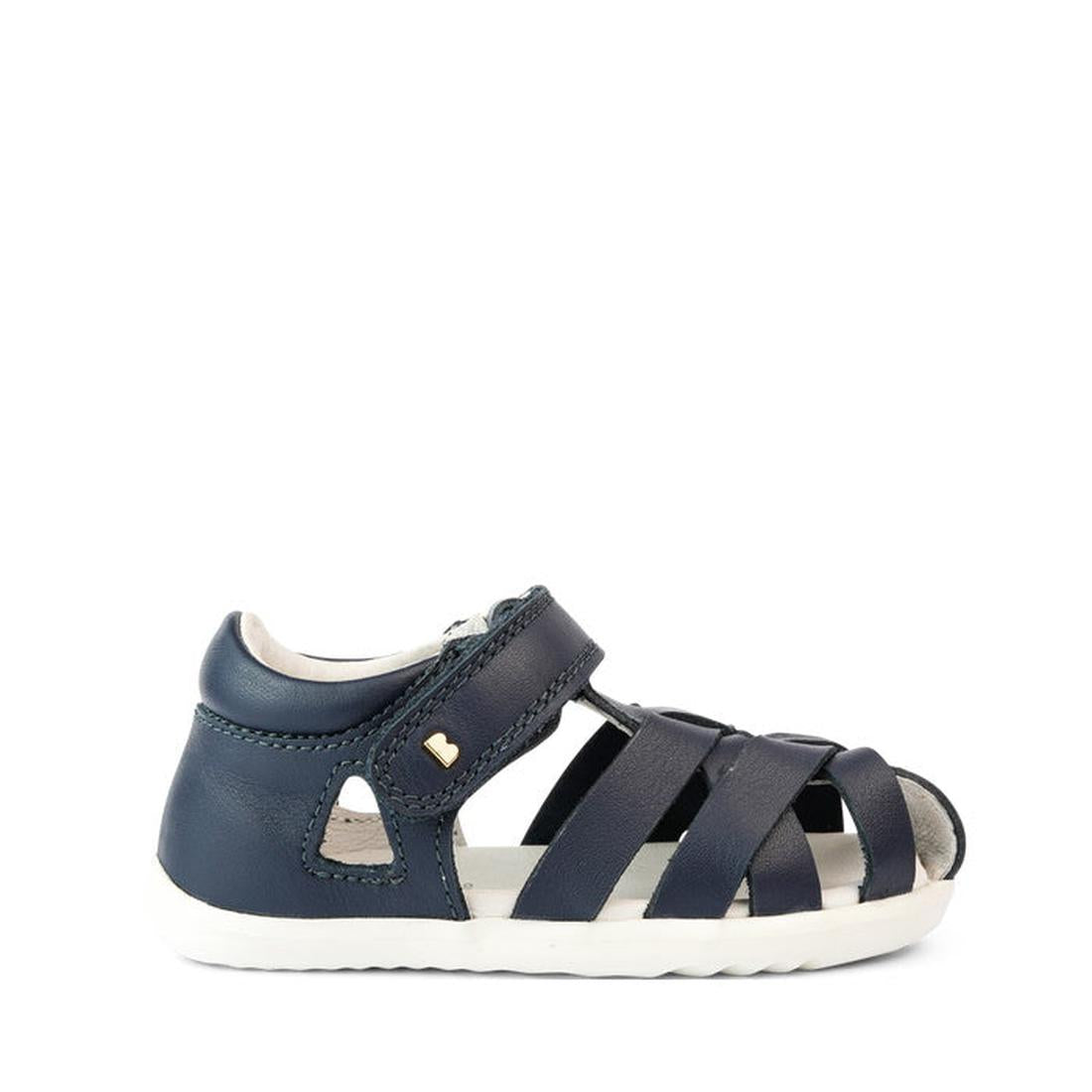 The Bobux Step Up Tropicana II Navy Sandal 732301 Quick Dry is a children’s navy sandal with a closed heel, open toe, double front straps, quick dry leather, white rubber sole, and velcro ankle strap for easy wearing., 9420068504158, 9420068504165, 942006