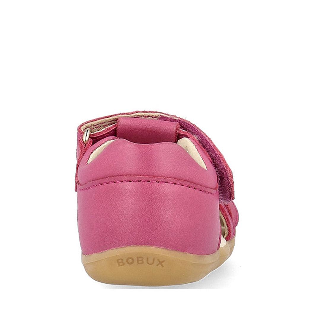 Rear view of the Bobux Step Ups Cross Jump Mauve Haze 731116 closed toe sandal for kids, featuring a pink leather upper, tan sole, embossed BOBUX logo on the heel, and a visible Velcro strap. Plain white background., 9420075773622, 9420075773288, 94200757