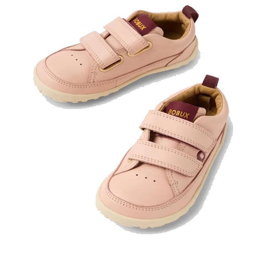 A pair of Bobux SU Step Up Dawn Leather Boot Cameo Rose Pink Alpha first walkers with cream soles, double Velcro straps, brown heel pull tabs, and the Bobux logo on the inner collar.