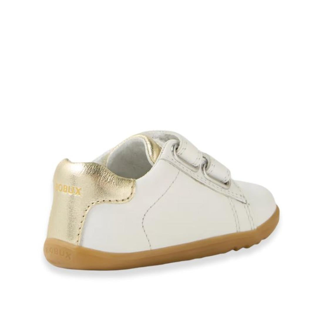 The Bobux SU Step Up Maverick Leather Toddlers Sneaker in White Gold features a small white leather design, gold heel accents, brown rubber sole, and two adjustable straps—perfect as a first walker for toddlers., 9420074836748, 9420074836755, 942007483676