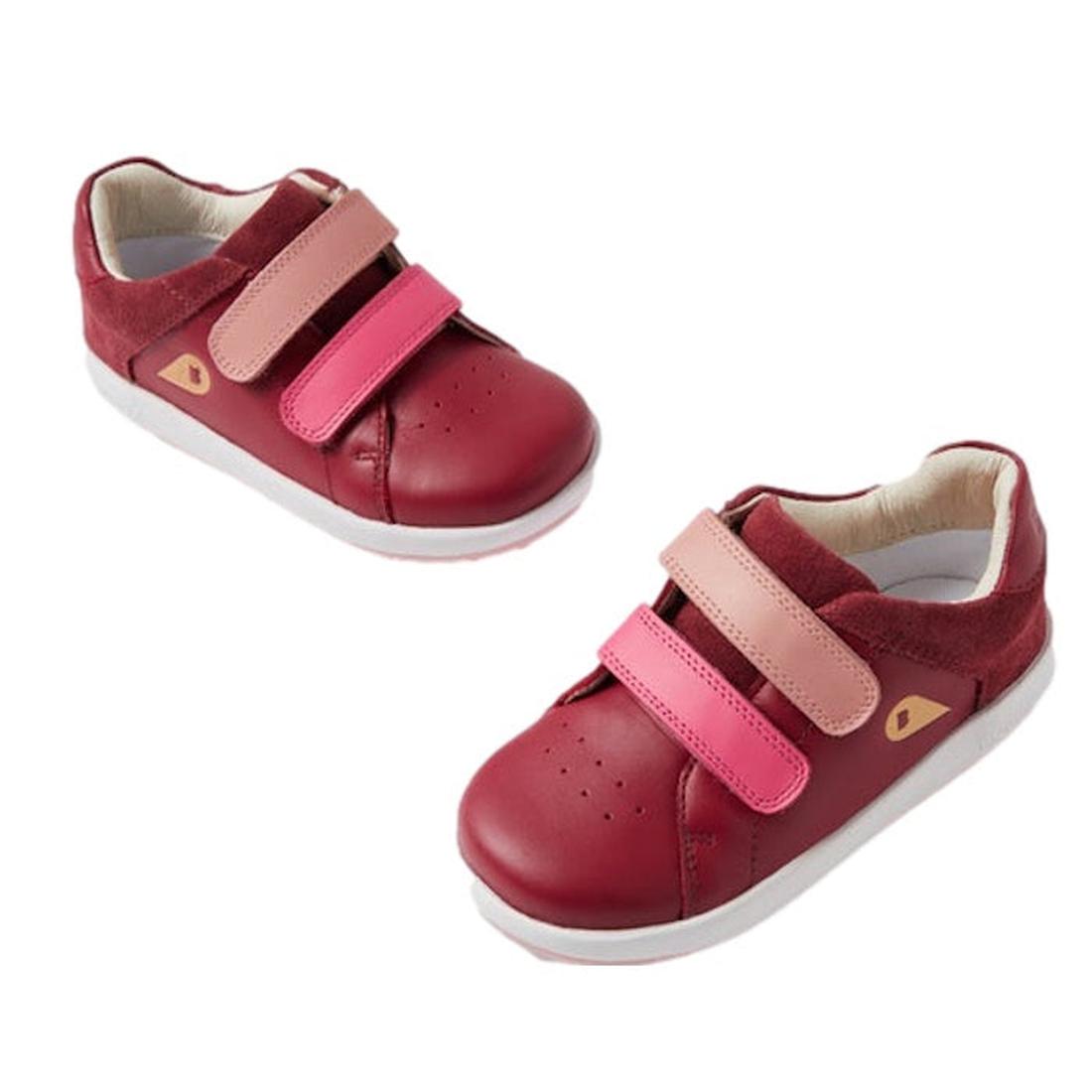 The Bobux IW Iwalk Breakpoint Leather Sneaker in Cranberry Red (652904) features red leather, light and dark pink Velcro straps, white soles, and a gold triangle logo—perfect casual sneakers for toddlers.