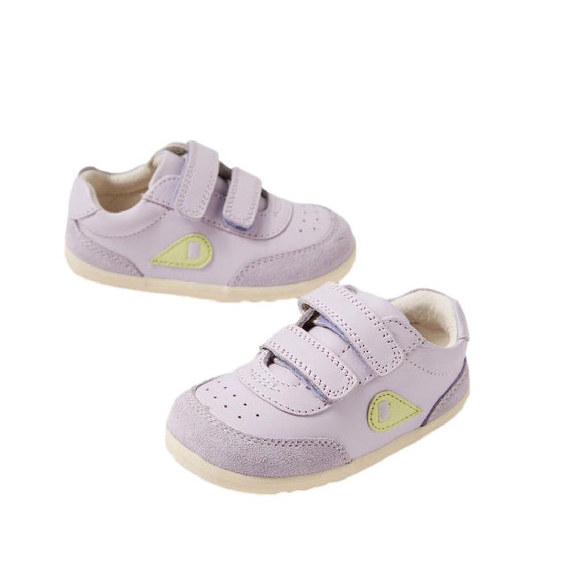 The Bobux Step Up SU Champ II Sneaker in Thistle Purple features beige soles, Velcro straps, perforated toes, and a yellow-green side detail. Displayed on a white background.