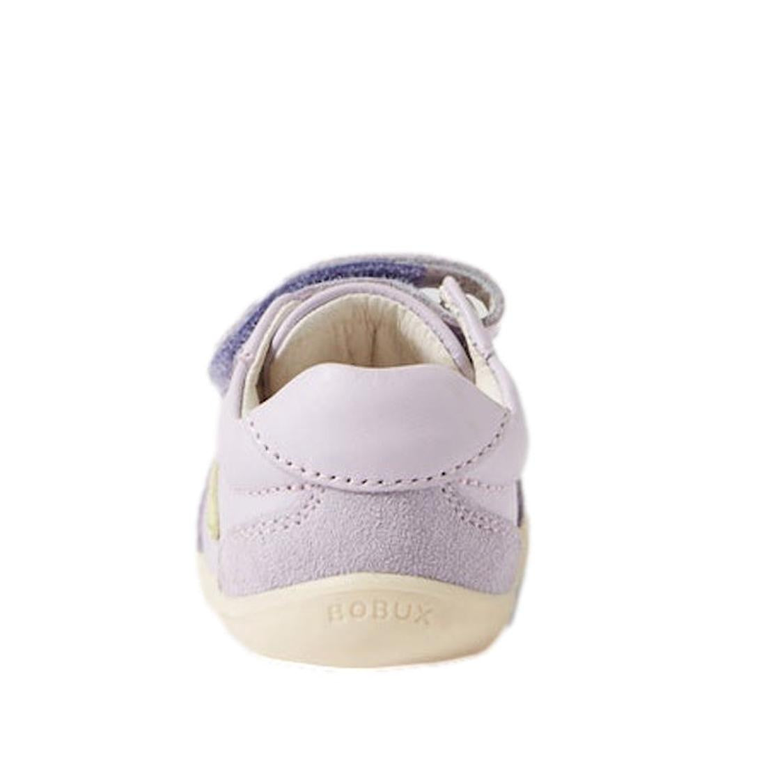 The Bobux Step Up SU Champ II Sneaker in Thistle Purple is a light purple and cream leather first walker for babies, shown from the back with BOBUX embossed on the sole and a visible Velcro strap at the top., 9420068552364, 9420068552371, 9420068552388