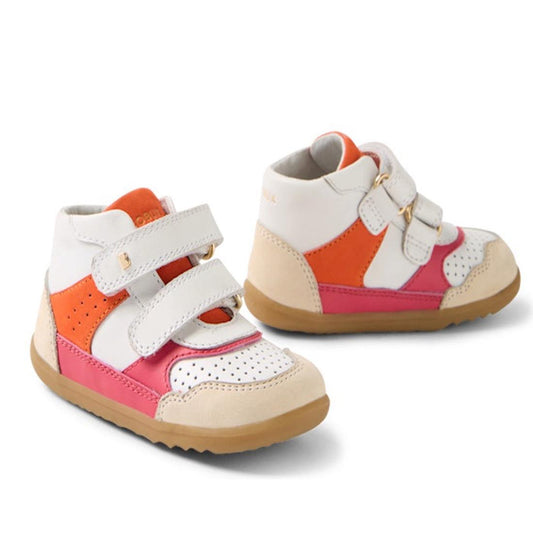 A pair of Bobux SU Harley First Walker Leather Boots in bright pink, featuring white, orange, pink, and beige panels with Velcro straps and brown rubber soles, shown on a white background.