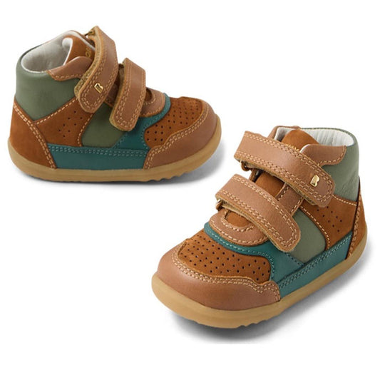 The Bobux SU Harley First Walker Leather Boots Tan are children's high-top shoes with brown, green, and teal panels, a perforated toe, two tan velcro straps, light brown soles, and a padded ankle collar.