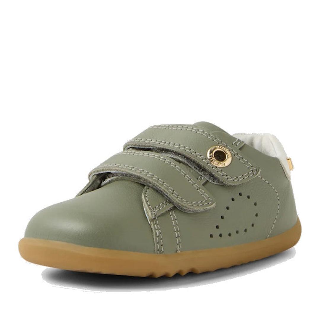 The Bobux SU Step Up Maverick Leather Toddlers Sneaker in Vetiver Green features a tan rubber sole, two adjustable straps, decorative stitching, and side perforations for breathability., 9420074836649, 9420074836656, 9420074836663