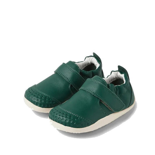 Bobux XP Xplorer First Walking Shoes Go Mediterranean Green: dark green pre-walker leather shoes for little ones, featuring white soles, Velcro straps, textured toes, and flexible soft material for comfort and easy wear.