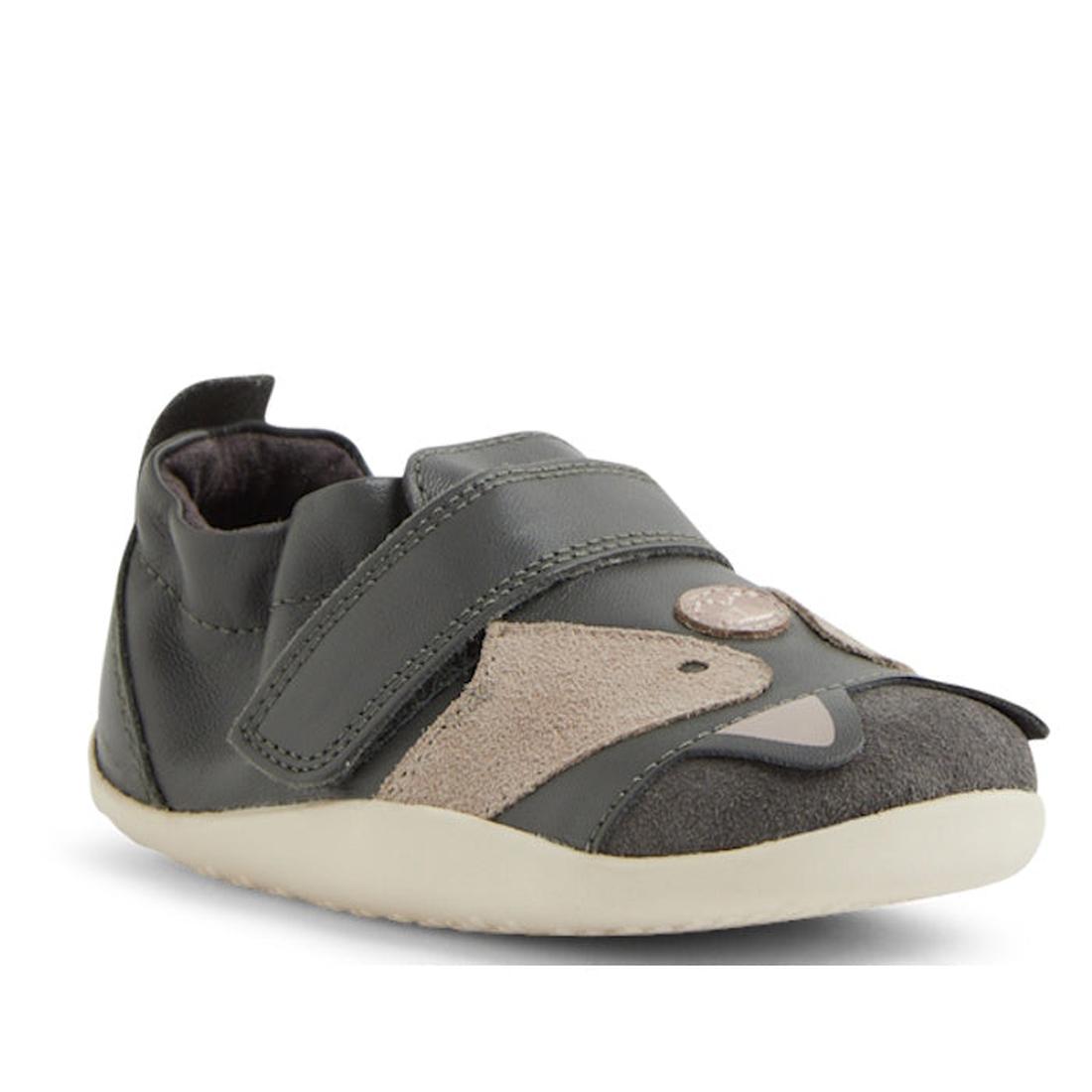 The Bobux XP Xplorer Scrunch First Walking Shoes in Smoke Grey feature beige accents, an adjustable strap, a cute animal face on the toe, and a light rubber sole—ideal pre-walker shoes for toddlers., 9420074805850, 9420074805867, 9420074805874, 9420074805