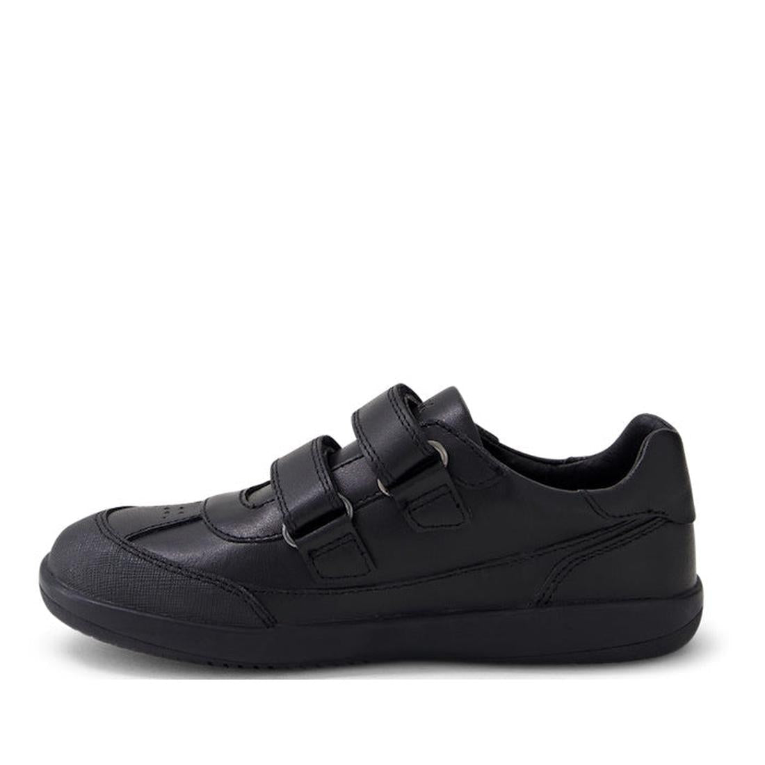 The Bobux Kid+ Black School Leather Shoe Traverse Trainer is a black, low-profile sneaker with two hook-and-loop straps and a textured sole, shown side-on against a plain white background., 9420075762978, 9420075762985, 9420075762992, 9420075763005, 94200