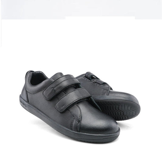 The Bobux Kid+ Black School Leather Shoe Venture Trainer is a low-top black sneaker with velcro straps and a non-marking rubber sole, shown on a white background.