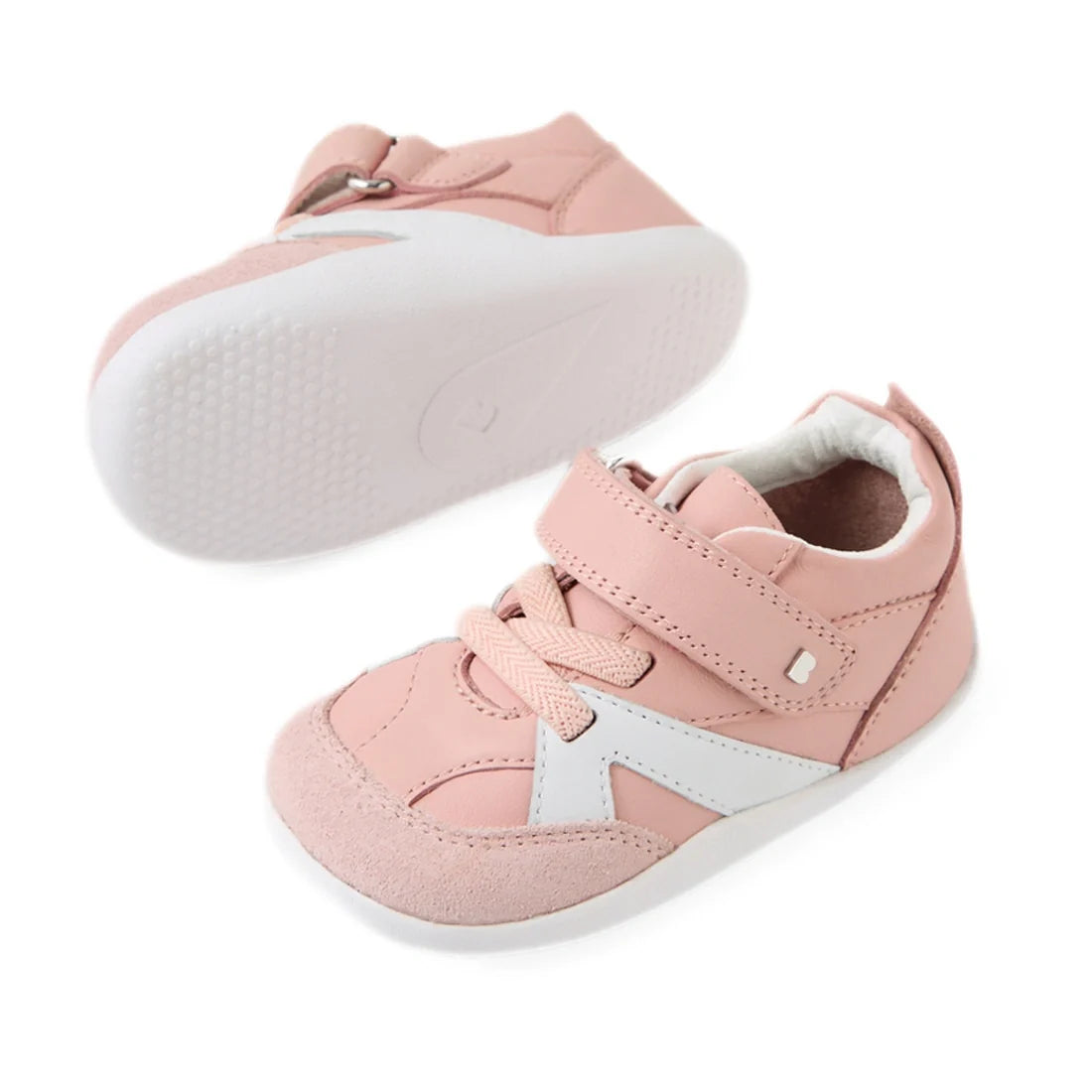 Bobux Xplorer XP Chase Ballet Pink First Walker Crawler—toddler sneakers in a soft pink hue, featuring white soles, pink and white accents, laces, and a Velcro strap. Perfect as pre-walker shoes or stylish baby sneakers, displayed on a white background., 