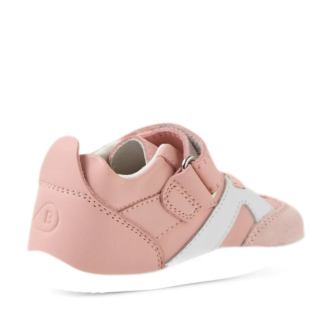 A Ballet Pink and white Bobux Xplorer XP Chase sneaker with a Velcro strap, shown from the back left side, featuring a textured sole and the letter B embossed on the heel—ideal as first walker crawler shoes for little ones., 9420074850683, 9420074850690, 