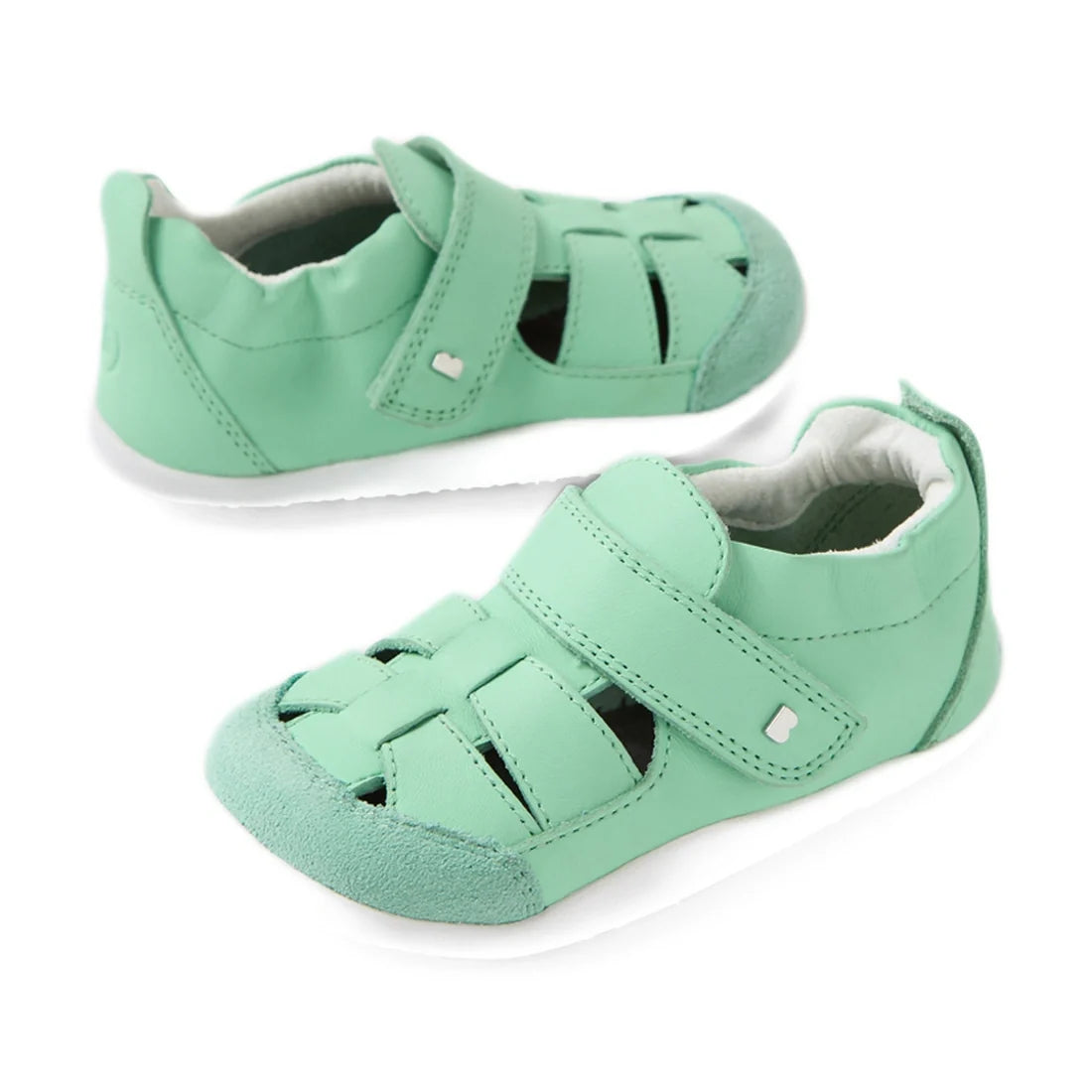 Introducing the Bobux XP Explorer Maris First Walker Sandal in Jelly Mint—a pair of light green sandals featuring velcro straps, soft soles, and an open ventilation design. Perfect as pre-walker shoes, shown here against a white background.
