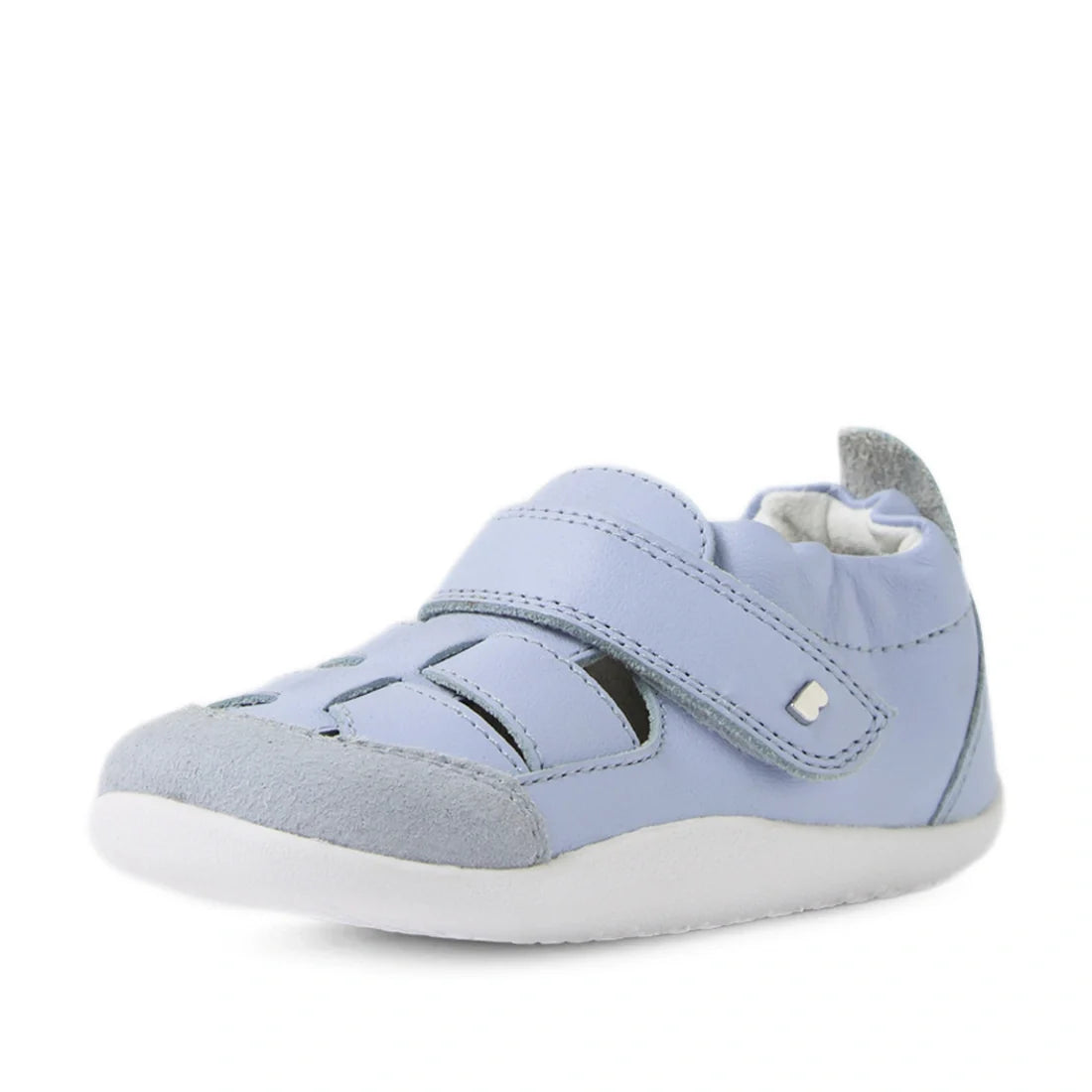 The Bobux XP Explorer Maris First Walker Sandal in Skyway Blue is a light blue baby shoe inspired by classic fisherman sandals, featuring a velcro strap, cutout details on top, a suede toe cap, and a soft white sole—ideal flexible leather shoes for little