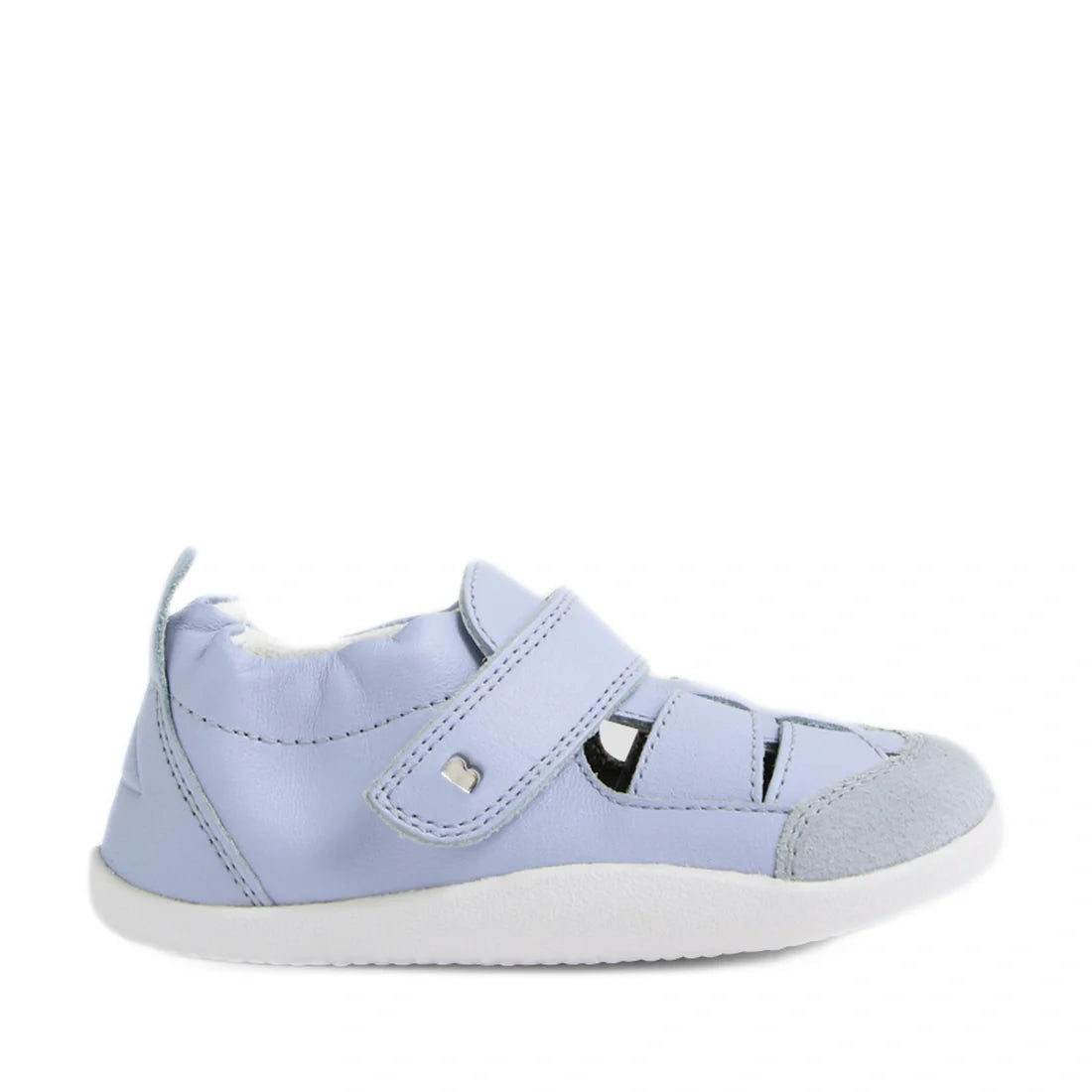 The Bobux XP Explorer Maris First Walker Sandal in Skyway Blue features a soft sole, velcro strap, and cut-out fisherman sandal design with a suede-like toe cap. This flexible leather baby walking shoe is shown from the side against a plain white backgrou