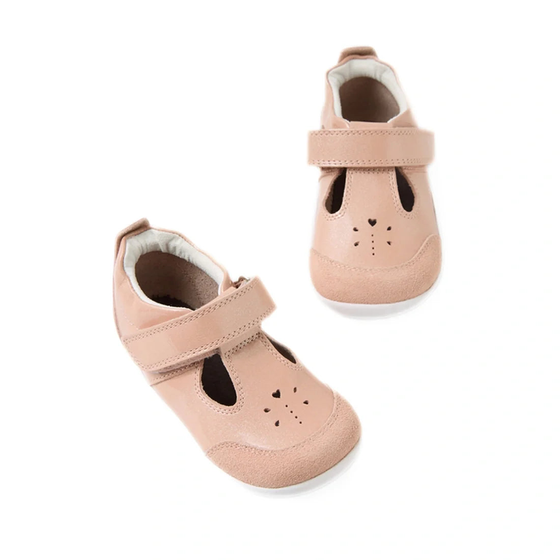 The Bobux XP Explorer Rue First Walker Sandal Camo Rose Pink is a pair of adorable light pink toddler sandals with flexible soles, Velcro straps, and playful animal face details with cut-out heart shapes and stitched noses, displayed on a white background