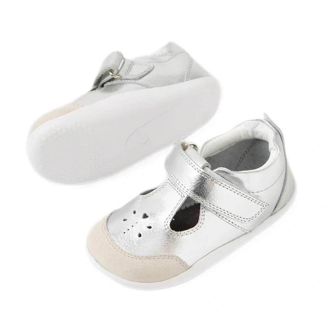 Bobux XP Explorer Rue First Walker Sandal Silver—this pair of shiny silver toddler shoes features white soles, beige toe caps, cutout detailing on the front, and easy hook-and-loop (Velcro) straps. Perfect as first walking or pre-walker shoes; one shoe is