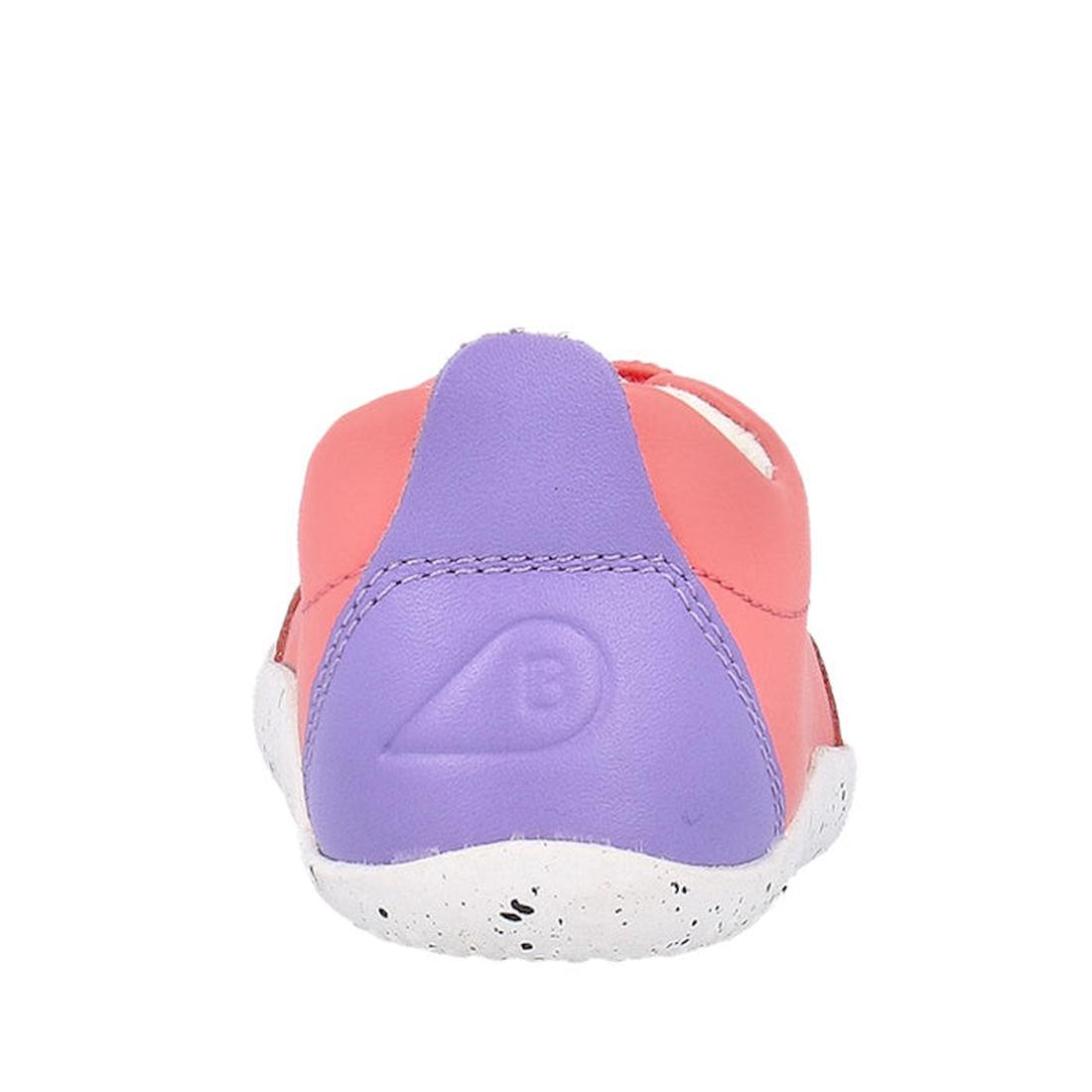 The Bobux XP Explorer Sport First Walker Sneaker Ocean Coral 502204, shown from the back, features a pink upper, purple heel with embossed logo, and a white speckled flexible sole against a plain white background., 9420075785427, 9420075783324, 9420075784