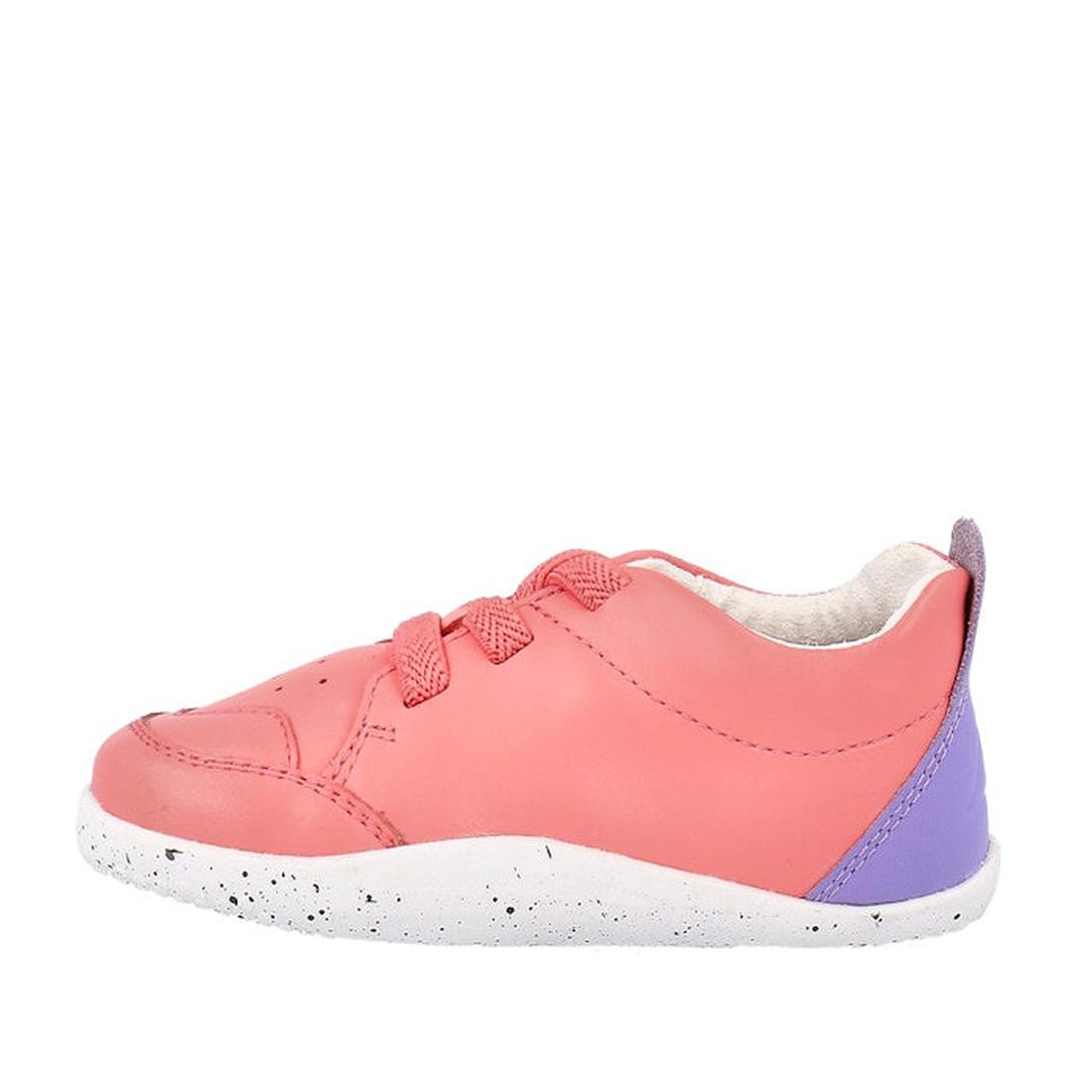 The Bobux XP Explorer Sport First Walker Sneaker Ocean Coral 502204 features pink uppers with matching laces, a flexible white speckled sole, and a purple heel accent, displayed from the side on a plain white background., 9420075785427, 9420075783324, 942
