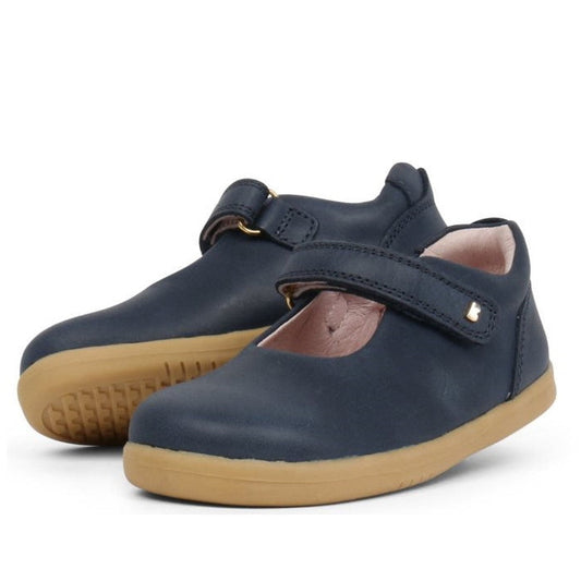 Bobux Iwalk Delight Mary Jane Navy 628026A—children’s navy blue leather shoes with tan rubber soles and Velcro straps, shown against a white background.