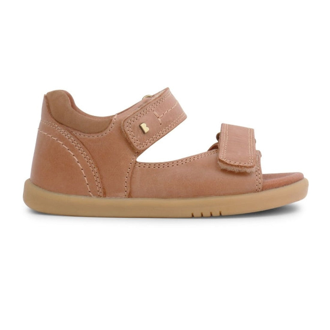 The Bobux IWalk Driftwood Sandal Caramel Open Toe 633606A is a children's light brown sandal with two adjustable Velcro straps and a flat rubber sole, shown in side profile on a white background., 9420062048085, 9420062048078, 9420062048092, 9420062048108