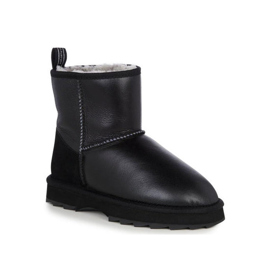 The Emu Womens Sharky Mini Town Black Boot is water resistant, with a textured sole, visible stitching, and a soft white shearling lining at the top.