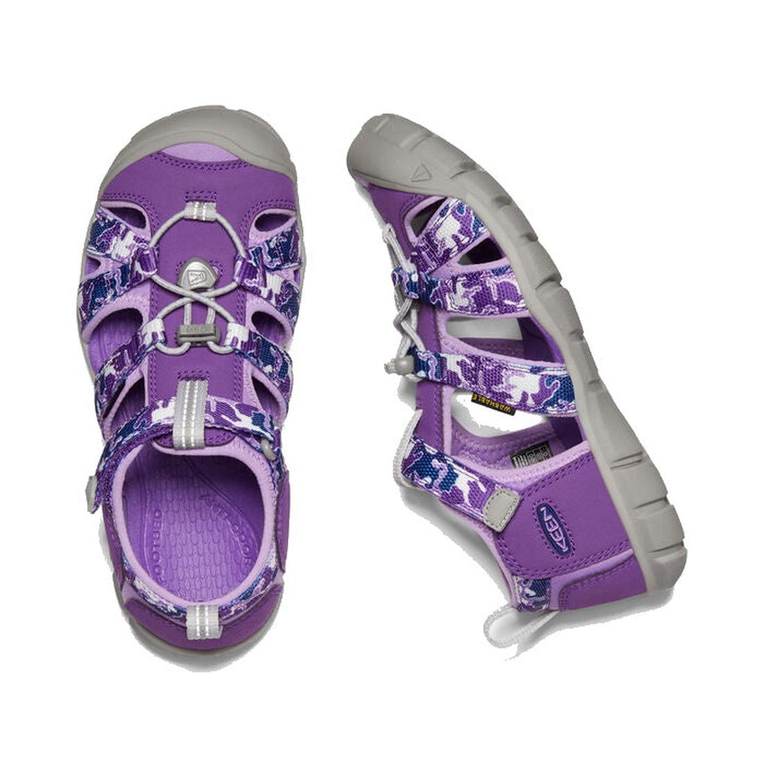 Keen Big Kids Seacamp 11 CNX sandals in camo Tillandsia purple, with comfy gray soles and easy elastic laces, shown top and side.  ksnz