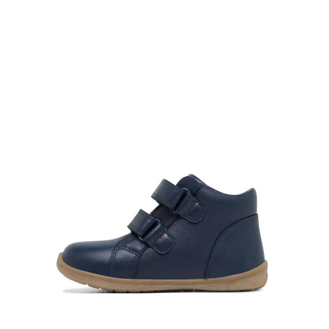 The Clarks Kids Manuela Leather Boot in navy features two Velcro straps, a light brown rubber sole, and is made from breathable leather for comfort. Shown from the side against a white background., 36288, 9336078980168, 9336078980182, 9336078980205, 93360